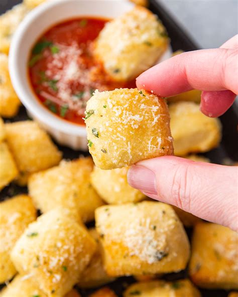 Parmesan bread bites. Preheat the oven to 350 F. In a frying pan warm two tablespoons of olive oil. Add the chopped bell peppers and cook on medium heat for 2 minutes. Add the … 