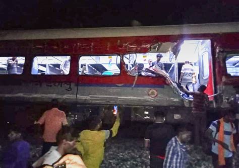 Passenger train derails in India, killing at least 50 and trapping many others