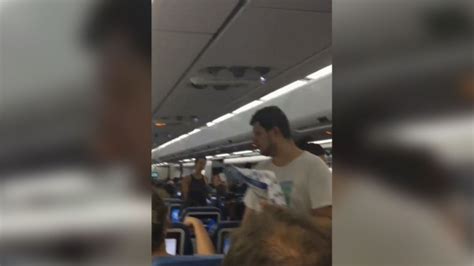Passengers stuck on hot plane for 7 hours say no food or water given out by crew