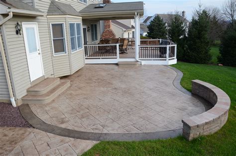 Patio concrete. The average cost for a 12′ x 24′ concrete patio is about $2,800, or $10 per square foot. The typical range for a concrete patio, depending on design, color, and texture, is $6 to $20 per square foot. This gives you a total range of $1,728 for a plain slab to a vibrant custom design that costs $7,500 . A classic gray slab with a brushed ... 