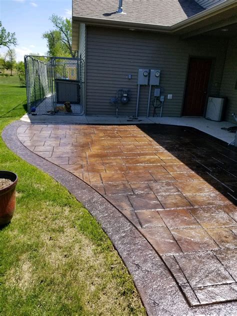 Patio with cement. Rinse with water and let it dry. If the stain doesn't improve, repeat the process, or try a concrete rust remover. Dish soap and water: Dish soap is a degreaser, and it works well to clean oily and grimy concrete. Create a cleaning solution of warm water and few drops of dish soap and apply it to the surface. 