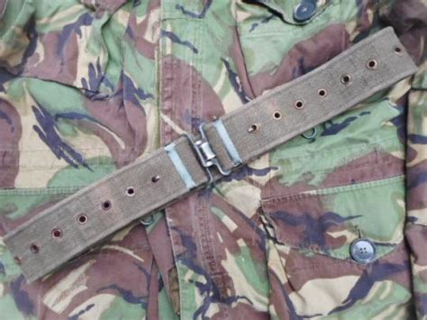 Pattern 70 webbing.  Her belt could be standard British Pattern 58 or So...