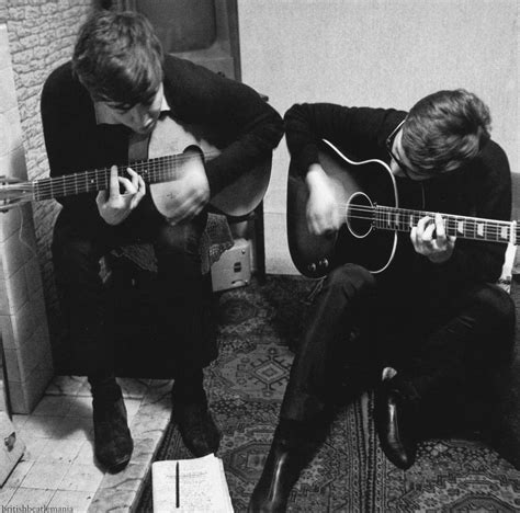 Paul McCartney and John Lennon during an early writing