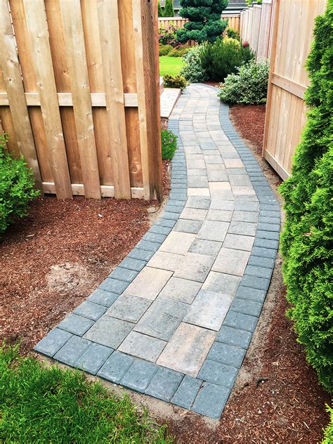 Paver stone walkway. Lay the Flagstones. Place the flagstones on top of the sand in the desired pattern. Keep the stones close together to avoid large gaps. If using paver sand, maintain a gap of about 2 to 3 inches between the stones. If using polymeric sand, a tighter seam must be maintained: 1/4-inch to 1-1/2-inch. 