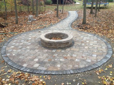 Paving for fire pit. Add some ambiance to your backyard setting. The Chateau Wall™ 50″ outside diameter fire pit is easy to assemble with mortar-free stack and glue construction. The kit includes three (3) circle rows of Chateau Wall™ Beveled pieces and glue. Make your fire pit pop with an optional Chateau Wall™ Beveled cap row in charcoal or with one of ... 