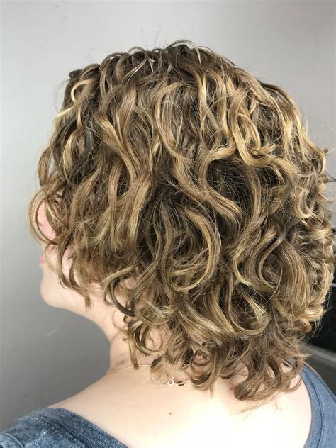 Peach and purple perm. Gentle Wavy Perm. A gentle wavy perm is the route to go to create a mane of soft, natural-looking wavy curls. Large perm rollers are used to create gentle waves, adding body and volume without looking artificial. These perms look best afterwards when the hair is allowed to air dry to avoid frizzing. 