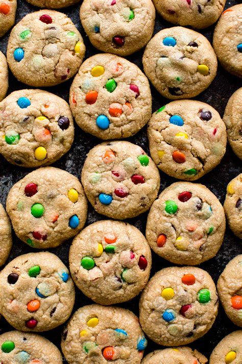 Peanut butter cookies m&ms. In a medium bowl, whisk together the flour, baking powder, baking soda and salt. In another medium bowl, using an electric mixer, beat the browned butter with sugars on medium speed until pale, about 2 minutes. Add egg and vanilla and beat until just combined. Add the peanut butter and beat until well combined. 