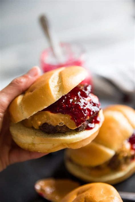 Peanut butter jelly burger. Leave about a ½” border so that the fillings don’t squeeze out when you press the sandwich. Press the inner piece of the Uncrustable maker into the bread to give a border for the fillings. Spread a thin layer of peanut butter on both sides of the bread, it will only be about a teaspoon or so. 