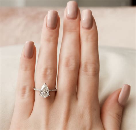 Pear ring. Only show stores that have your items in-store. PEAR-CUT Engagement Rings. The pear cut diamond is a unique shape featuring a rounded bottom tapering to a pointed top. Kay has a wide range of styles to choose from of pear cut engagement rings to find your partner the ring of their dreams. Wear the story of your love with pear cut engagement ... 