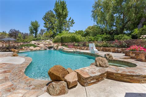 Pebble tec pool. Aug 11, 2021 · Pebble Tec is more pricey, and there tends to be two tiers of work. Low-end Pebble Tec pools can cost between $5,000 to $7,000 to refinish. High-end Pebble Tec layouts can cost as much as $15,000 for an average sized pool. It’s very rare to actually see a need for repairs, though thorough cleaning can come at a premium price. 