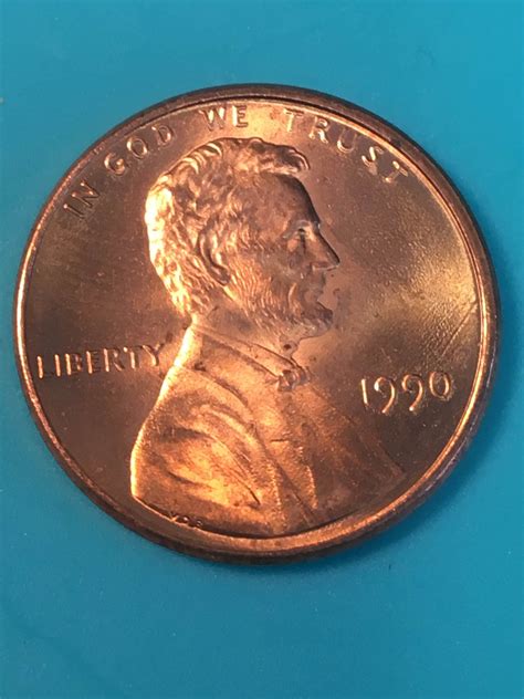 The 1990 no-mint mark proof penny was accidentally struck using a mint state die that had been mistaken to be a proof; the mint state die did not have a mint mark. The Mint admitted to destroying several no-S proof pennies struck in 1990.. 