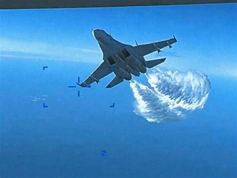 Pentagon video shows Russian jet dumping fuel on US drone