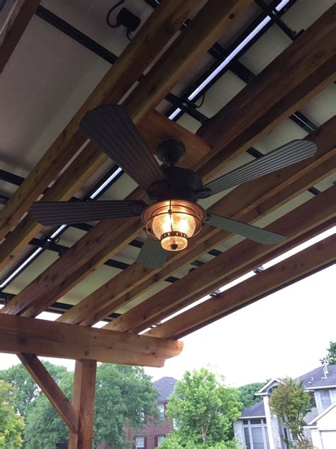 Pergola fan. Custom pergolas have come a long way in the last few decades. While simple designs are still popular, more and more homeowners are outfitting their pergolas with pergola accessories. From ceiling fans to heaters and lights, putting that comfortable indoor feel into your outdoor living space has never been easier. 