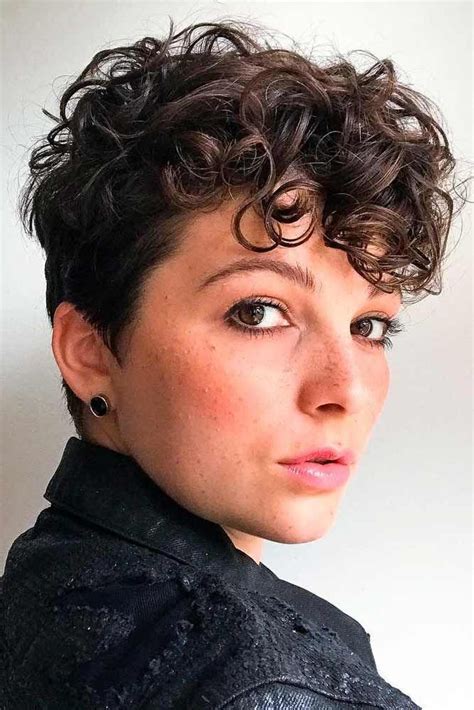 21. Curly Pixie with Fade. The curly pixie cut with a fade is a version of the hairstyle closer to the classic: the hair on the top is kept longer, giving the illusion of length and fullness, while the back and sides are gradually shorter. The appeal of this look is the structure, which looks neat and cool. 22.. 