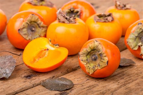 The persimmon ( / pərˈsɪmən /) is the edible fruit of a number of species of trees in the genus Diospyros. The most widely cultivated of these is the kaki persimmon, Diospyros kaki [1] – Diospyros is in the family Ebenaceae, and a number of non-persimmon species of the genus are grown for ebony timber. In 2019, China produced 75% of the ... . 