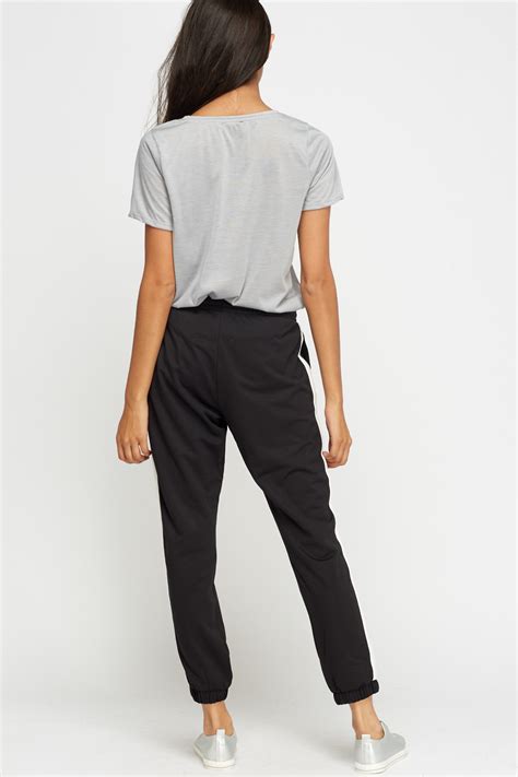 Petite joggers. ASOS DESIGN Petite slim trousers in black. £22.00. In The Style Petite x Perrie Sian wide leg drawstring trouser in grey pinstripe. £44.00. River Island wide leg trousers in blue. £38.00. MIX & MATCH. 4th & Reckless Petite exclusive … 