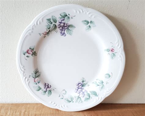 Doubling as a serving platter, the refined country motif features a defining periwinkle trim on a white background. Coordinate this 10-1/2-inch foundational plate with the Merlot dinnerware pattern in various complementary designs. The durable earthenware is dishwasher-, microwave-, and freezer safe, and carries Pfaltzgraff three-year warranty..