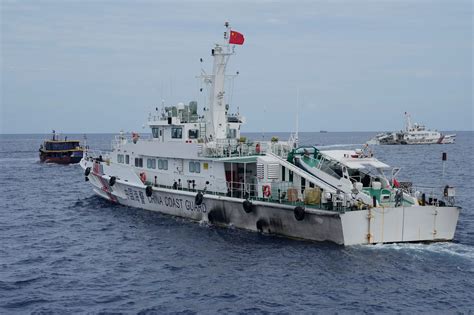 Philippine coast guard says it removed barrier placed by China’s coast guard in disputed shoal