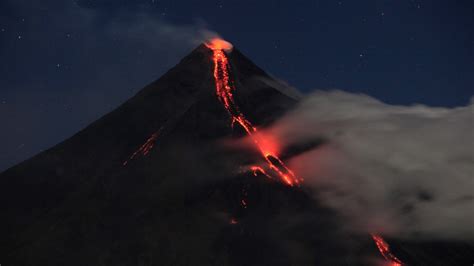Philippines’ Mayon Volcano spews lava down its slopes in gentle eruption putting thousands on alert