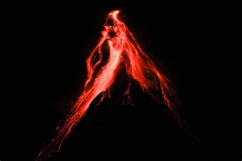 Philippines’ Mayon Volcano spews lava in gentle eruption, thousands warned to be ready to flee