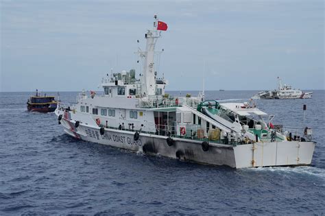 Philippines says it will remove any barrier China installs in the disputed South China Sea