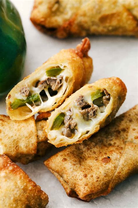 Philly cheesesteak egg rolls. Spray the air fryer basket with oil and place the egg rolls in the basket, leaving a little room between each roll. Mist rolls with oil. Cook for 8 minutes at 380°F, turning at the halfway point. Cook until egg rolls are crispy and golden brown on all sides. Cool for 5-10 minutes before serving. 