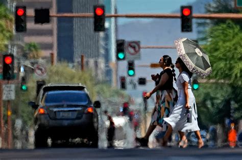 Phoenix scorches at 110 for 19th straight day, breaking big US city records in global heat wave