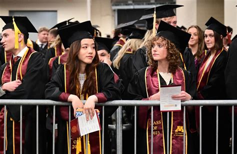 Photos: New graduates from the University of Minnesota brave the rain