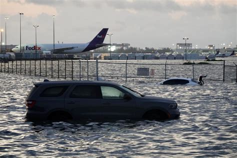 Photos: Wind and rain pound South Florida, major flooding closes roads, airport