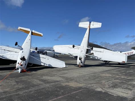 Photos: planes overturned by high winds at Concord airport