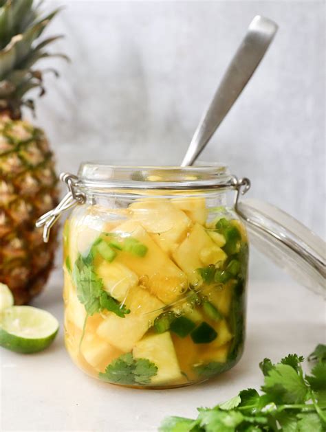 Pickled pineapple. Slice the pineapple in thin rings. Add to your wide mouth canning jar with the cilantro. Pour the vinegar mixture over the top of each jar, allow 1/2 inch headspace. The vinegar should barely cover each jar, if not, top with a bit of water. Place the lid and ring on each wide mouth jar. Refrigerate for 12-24 hours before enjoying. 