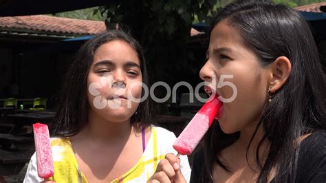 Picture of girl sucking popsicle.  Explore AI-generated pictures and stoc...