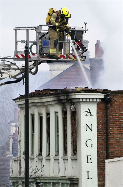 Pictures as fire destroys 400-year-old hotel full of refugees