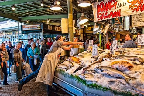 Pike place market fish throwing. The Market is a block long, two sides of the street affair underneath the Pike Place Market sign. Most of the time, especially the week-end, there are lots of folks but the variety of fruit, flowers, fish and all manner of good things to eat and drink make it worthwhile. 