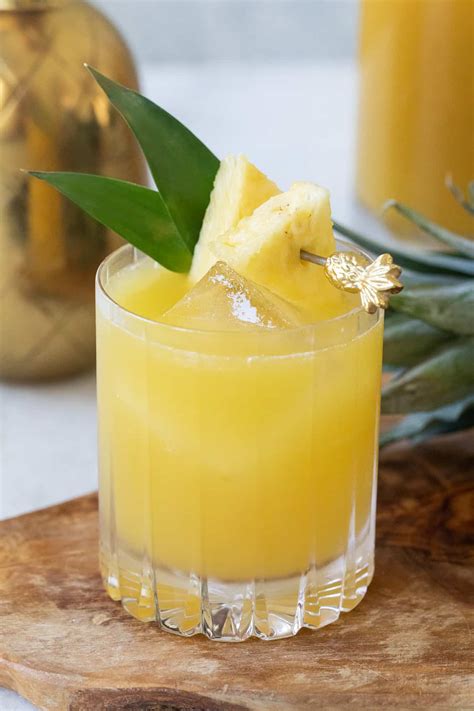 Pineapple cocktails. Oct 2, 2020 · In a cocktail shaker, muddle the mint with the sugar and lime wedges. Add the rum, pineapple juice and Maraschino liqueur to the cocktail shaker. Fill it with ice and shake until cold. Strain the drink into a glass. Shake on the bitters if desired. Garnish with mint, a lime wedge and a pineapple slice. 