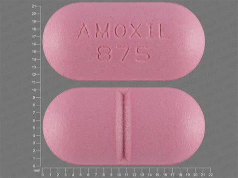 amoxicillin 875 mg tablet. Color: pink Shape: oblong Imprint: AMOXIL 875 . This medicine is a pink royal blue, oblong, capsule imprinted with "AMOXIL 500" and "AMOXIL 500".. 