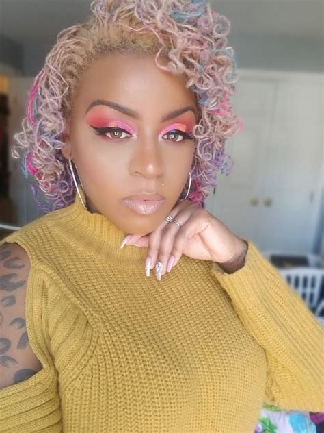 Pink and blonde locs. The first look Bailey blesses us with is this glittering silver masterpiece. She struts down a pink corridor in a metallic two-piece bikini and gold ruffled jacket with her blonde locs flowing ... 