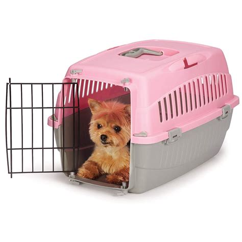 Pink dog cage. This black-coloured metal frame cage comes with two doors, one on the side and one on the end. The dog crate folds flat to make travelling or storing easy and comes with a travel handle when packed away so you can move it easily. The included metal base tray is removable for easy cleaning as required. With a 91cm size, your dog will be able to ... 