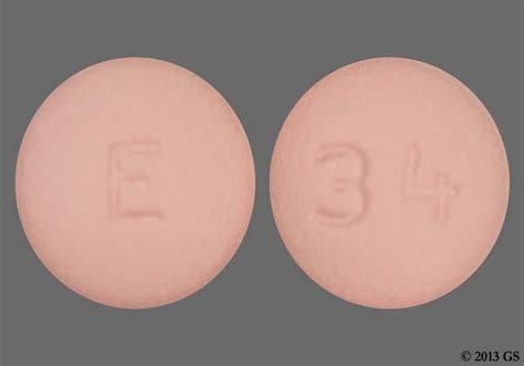 Pill with imprint E 404 is Orange, Round and has been id