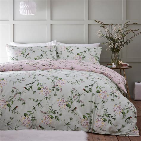 Available in 4 bedding sizes. Add a colourful touch to your bedroom with our Joy Patchwork Duvet Cover and Pillowcase Set, crafted from a soft blend of recycled polyester and cotton to give you ultimate comfort and cosiness whilst sleeping. This bedding set is designed with a bold and colourful patchwork print with a coordinating floral design .... 