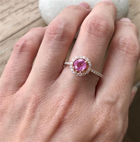 Pink sapphire engagement rings. Engagement rings are a symbol of love and commitment, making them an important purchase for many couples. However, shopping for the perfect engagement ring can be overwhelming, esp... 
