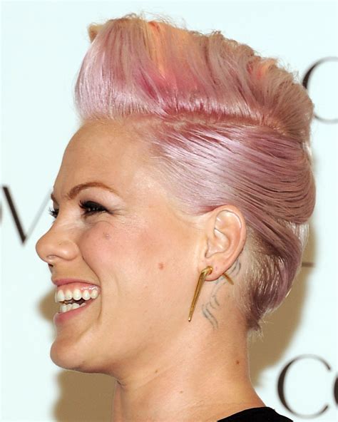 Pink the artist hairstyles. 1. The Shaggy Pixie: One of Pink’s most popular hairstyles is the shaggy pixie. This haircut features short, choppy layers that are styled in a messy, tousled way.To achieve this look, ask your stylist to cut your hair into a layered pixie cut with lots of texture and volume. 