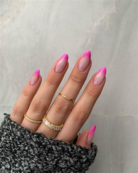 Pink tip almond nails. All you need to achieve this charming look is a baby pink French tip adorned with painted clouds on the ends. 4 ... file your nails into an almond shape and paint the tips with a thin blue line ... 
