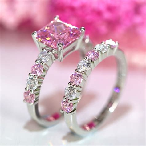 Pink wedding ring. The Best Pink Wedding Rings Pink is an exciting color that can be used in many ways when it comes to the style and design of wedding bands. For example, our most popular pink ring is the Archean, which is a pink dinosaur inlaid wedding band. Also extremely popular is our pink/rose gold plated tungsten wedding band, the 