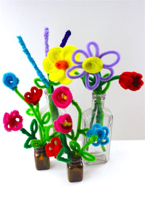 Pipe cleaner flowers. How to make pipe cleaner flowers. Grab a green pipe cleaner and place one green pony bead about a quarter inch from the bottom of it. Twist the end around the bead to create a knot. String 11 green beads onto the rest of the pipe cleaner. Then, loop it right above the last bead to make a leaf. Repeat again so that you have two leaves. 