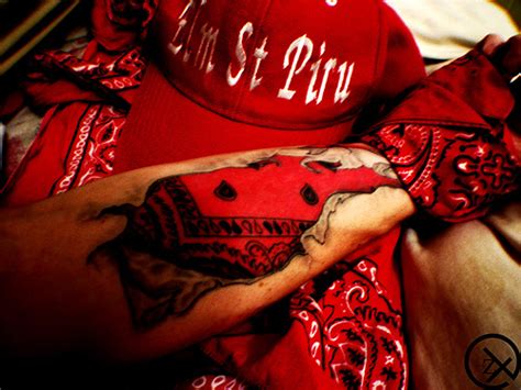Piru tattoo. Copyright 2022 Walcott Radio. Him looking at a photo of himself in those darker days fits when the songs about self-reflection upon past mistakes. 