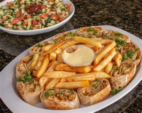 Pita palace. Three falafel cakes lettuce, tomato and tahini sauce served in a pita. Served with fries. Chicken Gyro Wrap Combo $15.25. Chicken gyro, lettuce, tomato, onions, and dijon mustard served in a pita. Served with fries. Beef Kebob Wrap Combo $15.25. Grilled beef, onion, tomato, and tzatziki sauce served in a pita. 