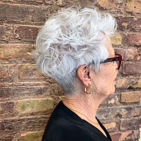 Pixie cuts for curly hair over 60. 1. Feathered Pixie Haircut. This platinum blonde pixie is perfect for women over 60 looking to embrace their gray hair. The feathered fringe is a little longer around the face to add a feminine touch to a short haircut. Don't forget to use purple shampoo to keep your hair color bright and brass-free. @presleypoe. 