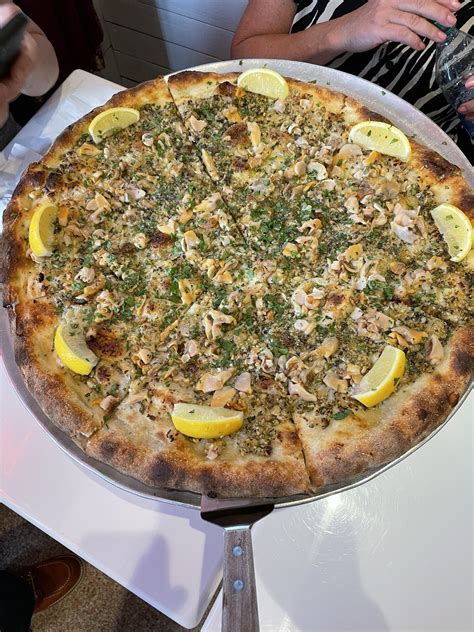 Pizza astoria. You hear pizza, you think cheese that flows like roof tar; pepperoni slices cupping in the oven, filling with grease; and a crust so overladen with toppings it droops like sorrow w... 