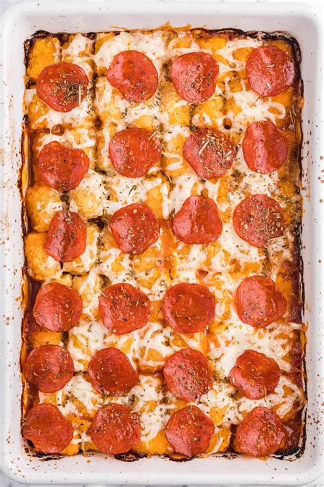 Pizza tater tots. Once you are able to handle them, skewer 6-7 tater tots onto each skewer and place back onto the sheet pan. Spoon the pizza sauce onto each skewer, making sure you cover each of the tater tots. Then add a layer of cheese, a layer of pepperoni, and then another layer of cheese. Into the oven for another 10 minutes at 350 degrees. 